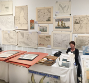 Dedra Ashman takes a well-deserved rest during a hectic afternoon at the 2016 Miami International Map Fair.